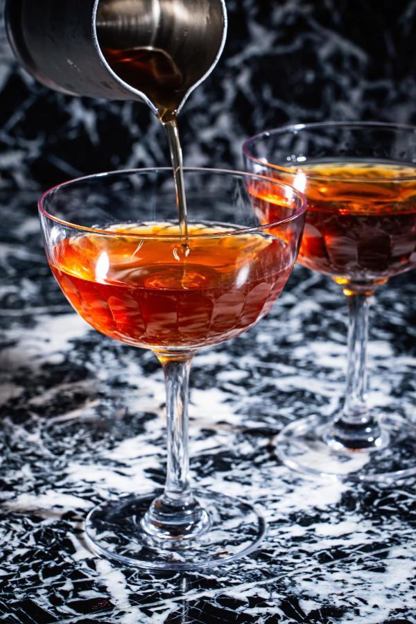 Riggs Washington Dc Hotel Bagian luar foto A cognac being poured into a glass